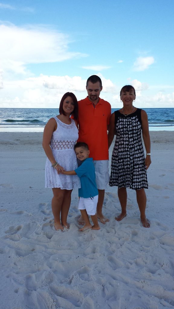 Samantha, Corey, their son, and me after their short and sweet Clearwater Beach Wedding in the morning