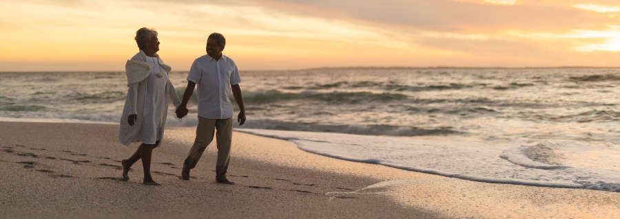 couple walking on clearwater beach after an elopement ceremony