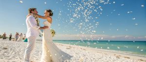 wedding couple after the ceremony on a clearwater beach in Florida